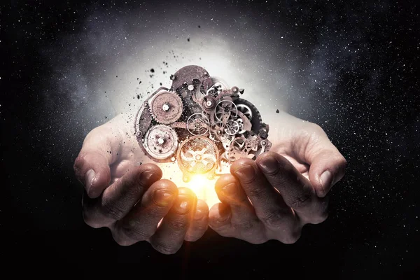 Dişli mekanizması elinde. Karışık teknik