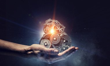 Dişli mekanizması elinde. Karışık teknik