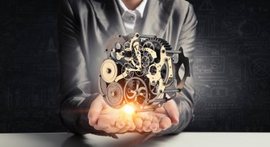 Dişli mekanizması elinde. Karışık teknik