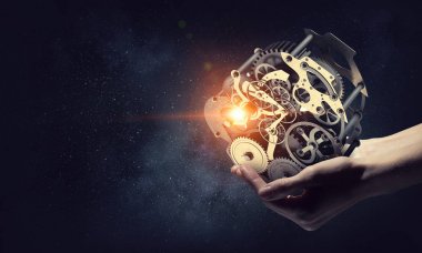 Dişli mekanizması elinde. Karma ortam. Karışık teknik