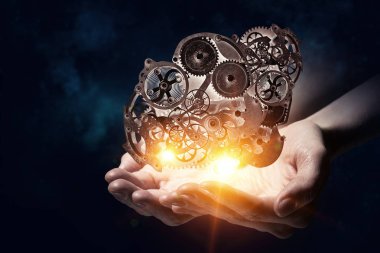 Dişli mekanizması elinde. Karma ortam. Karışık teknik