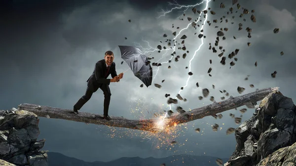 Podnikatel s černým deštníkem. Kombinovaná technika — Stock fotografie