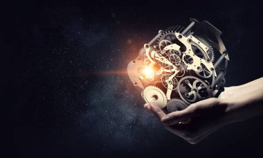 Dişli mekanizması elinde. Karma ortam. Karışık teknik