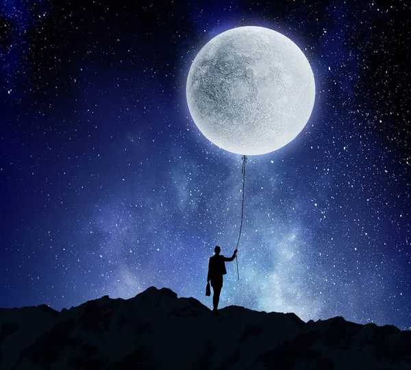 Mujer atrapando la luna. Medios mixtos —  Fotos de Stock