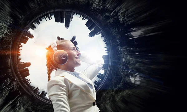 Woman wearing white headphones. Mixed media — Stock Photo, Image