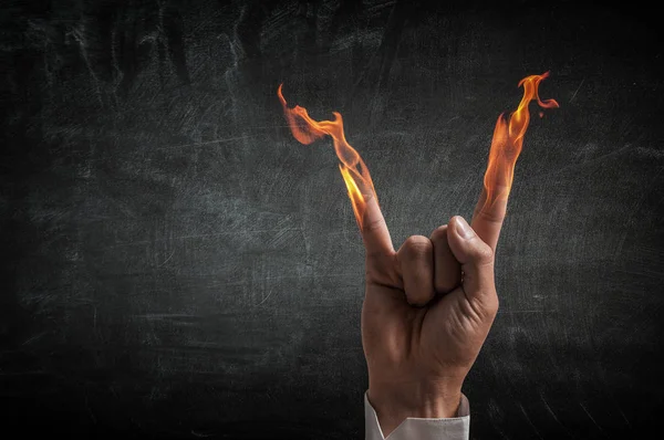 Fire burning in his hands — Stock Photo, Image