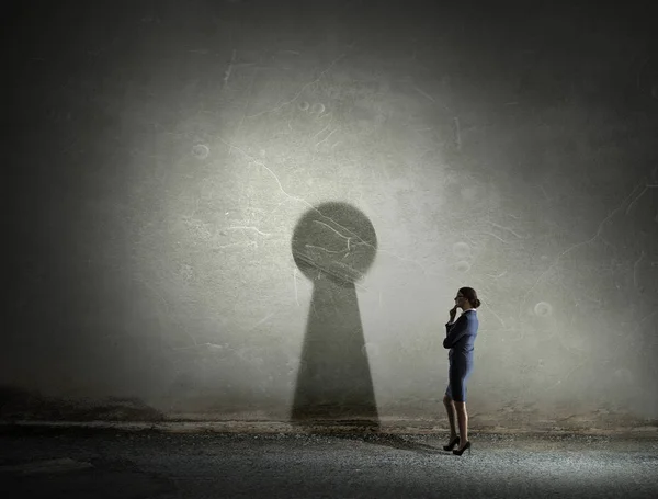 Businesswoman in empty room . Mixed media — Stock Photo, Image