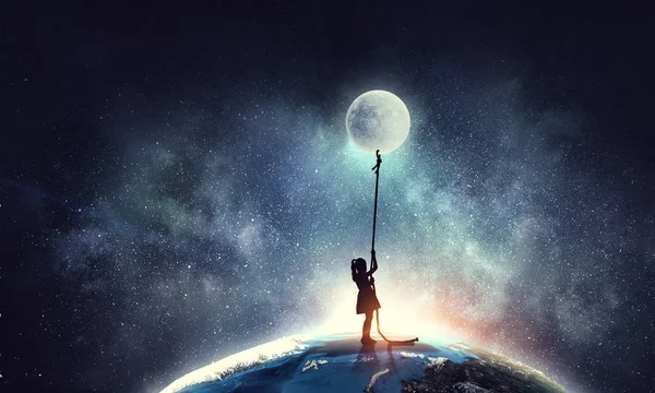 Kid girl catching moon — Stock Photo, Image