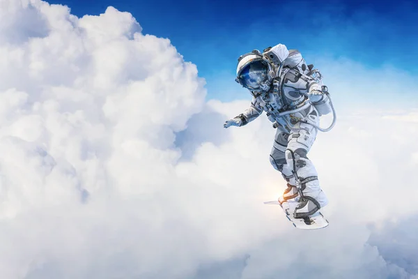 Spaceman on flying board. Mixed media — Stock Photo, Image