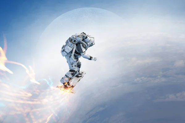 フライング ボード上の宇宙飛行士。ミクスト メディア — ストック写真