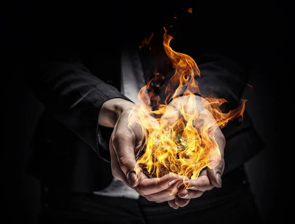 Fire burning in her hands — Stock Photo, Image