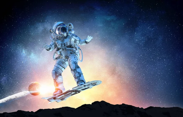 Spaceman on flying board. Mixed media — Stock Photo, Image