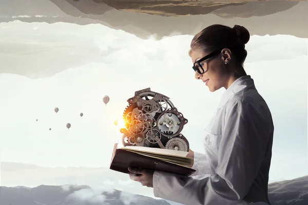 Woman scientist reading book. Mixed media — Stock Photo, Image