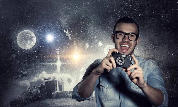 Guy with retro photocamera. Mixed media — Stock Photo, Image