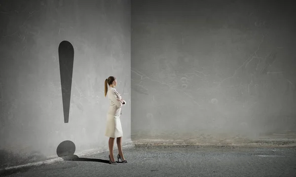 Businesswoman in empty room . Mixed media — Stock Photo, Image