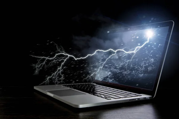 Laptop met bliksem. Mixed media — Stockfoto