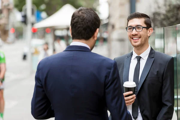 Two businessmen talking outdoors — Stock Photo, Image