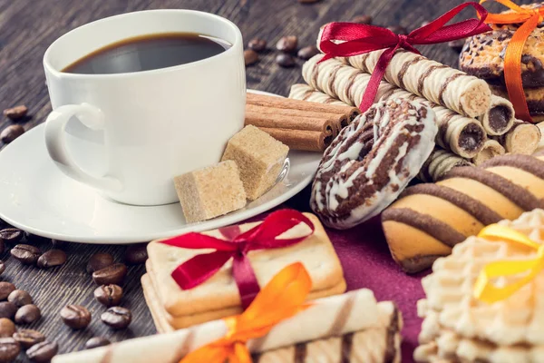 Assorted cookies and cup of coffee — Stock Photo, Image