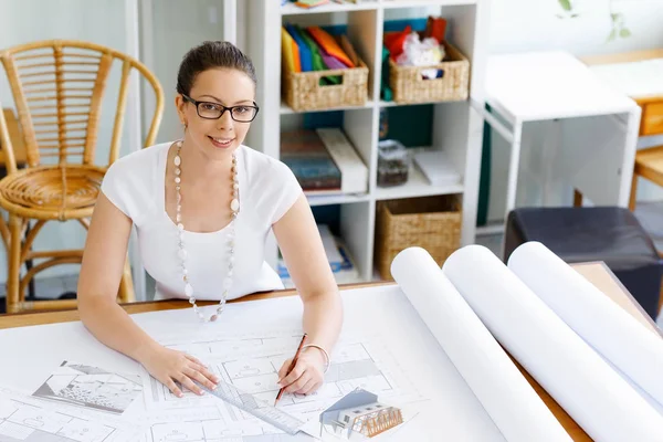 Young woman architect in office — Stock Photo, Image