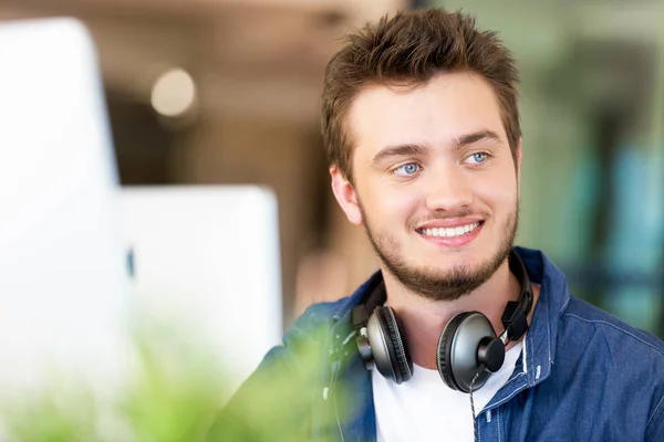 Young man working in office — Stock Photo, Image