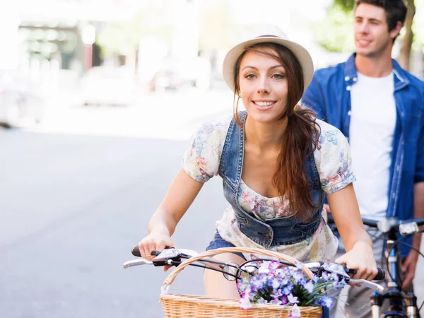 Beautiful woman riding on bike — Stock Photo, Image