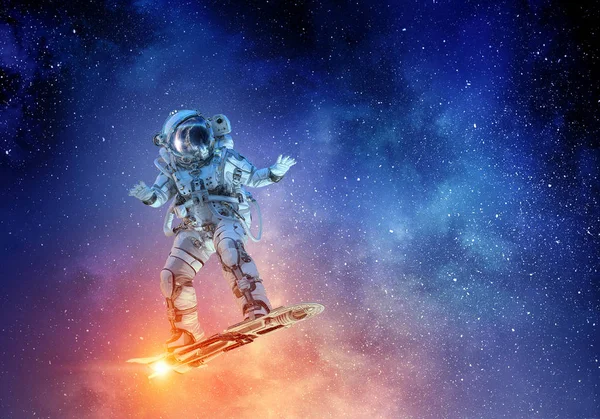 Spaceman on flying board. Mixed media — Stock Photo, Image