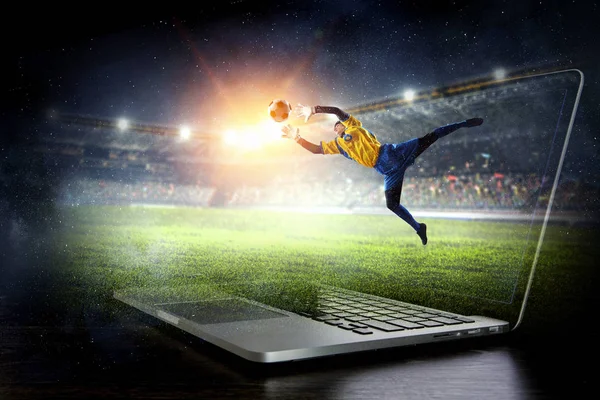 Soccer goalkeeper in action. Mixed media — Stock Photo, Image