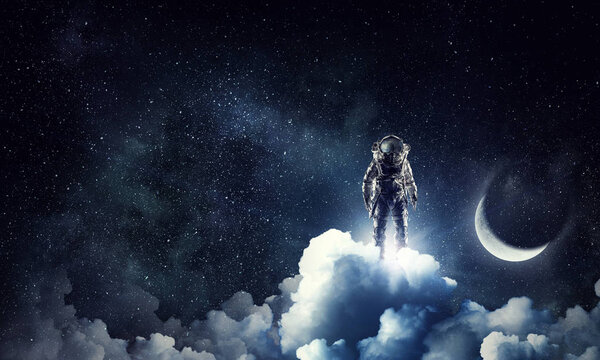 Astronaut in dark sky and moon planet. Elements of this image furnished by NASA