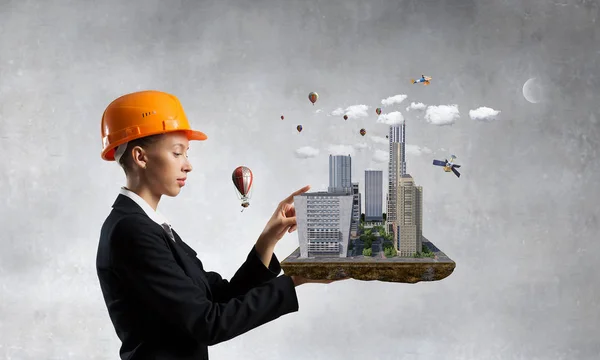 Woman presenting construction project. Mixed media — Stock Photo, Image