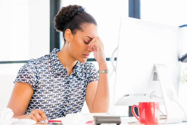 Portrait of tired afro-american office worker sitting in offfice — Stock Photo, Image
