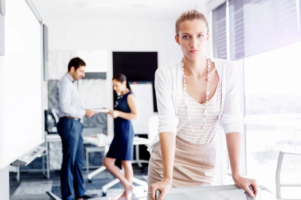 Attractive female worker in office — Stock Photo, Image
