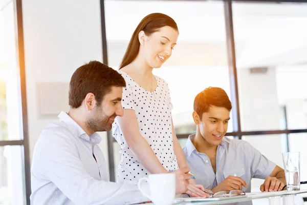 Group of happy young business people in a meeting — Stock Photo, Image