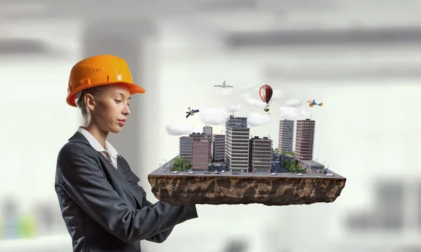 Woman presenting construction project. Mixed media — Stock Photo, Image