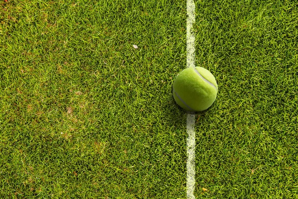 Tennis ball on the court — Stock Photo, Image