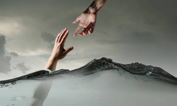 Hand of person drowning in water — Stock Photo, Image