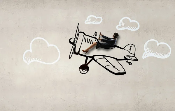 Woman in drawn airplane . Mixed media — Stock Photo, Image