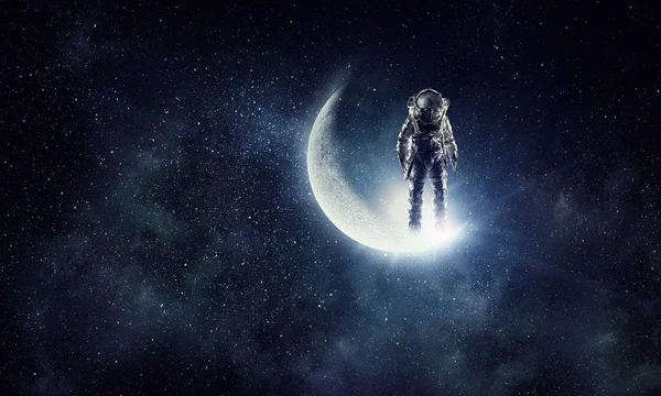 Astronaut explorer in sky. Mixed media — Stock Photo, Image