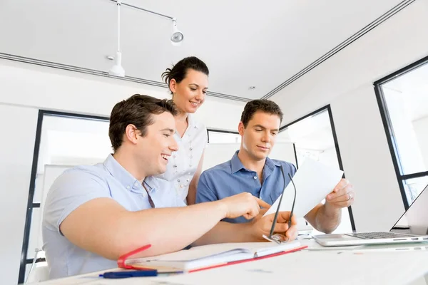 Group of happy young business people in a meeting — Stock Photo, Image