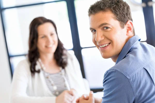 Young man in casual in office — Stock Photo, Image