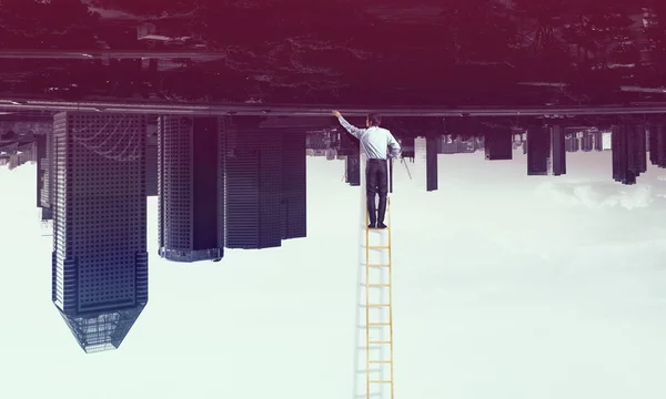 Businessman on ladder — Stock Photo, Image