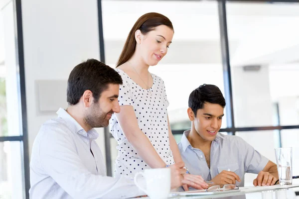 Group of happy young business people in a meeting — Stock Photo, Image