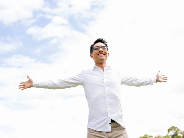 Young happy and successful businessman during his break in park — Stock Photo, Image