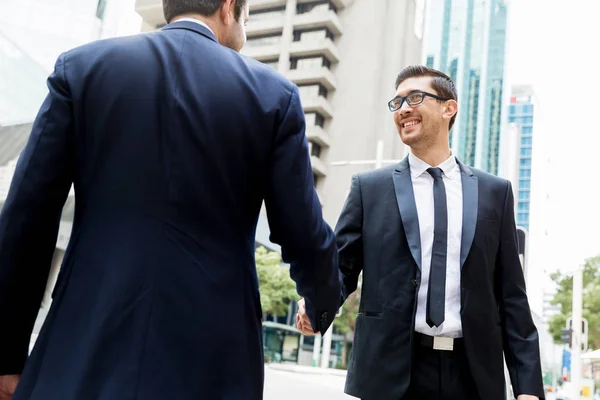 Two businessmen shaking their hands — Stock Photo, Image