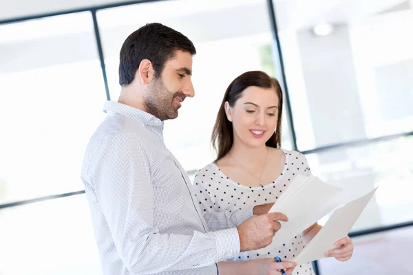 Image of two young business people in office Royalty Free Stock Images