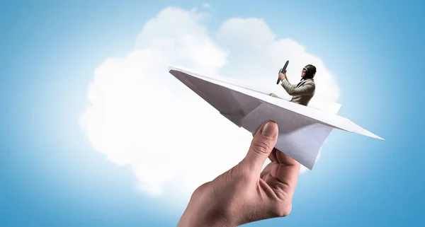 Aviator in papier vliegtuig. Mixed media — Stockfoto
