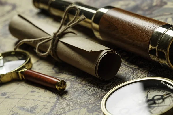 Retro compass with old map and spyglass — Stock Photo, Image