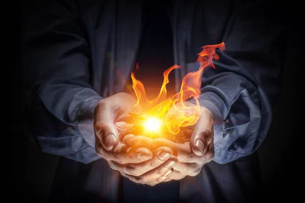 Fire burning in his hands — Stock Photo, Image