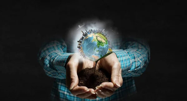 Planet Earth in our hands . Mixed media — Stock Photo, Image