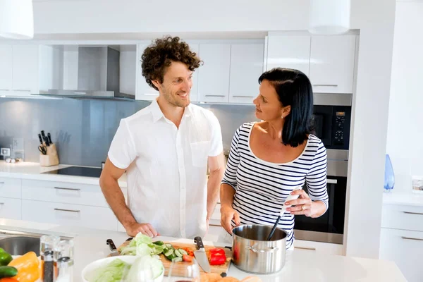 Couple cooking together at home