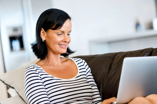 Beautiful woman working on her laptop — Stock Photo, Image